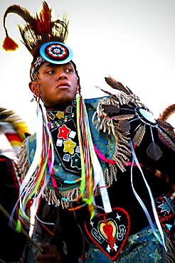 A Native American man participates in a dance at a powwow in Mesa Verde, Colorado.