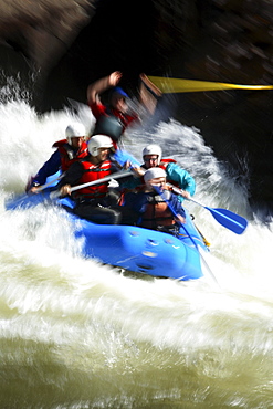 Motion-blur photo of unknown whitewater rafters crashing through Pillow Rock rapid on the Upper Gauley river near Fayetteville, WV