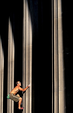 Justin Bastien buildering up a column in Salt Lake City, Utah.