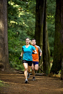 Jennifer & Adam Ray trail running in the East Bay Hills above Berkeley and Oakland, California.