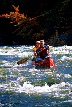 Rob Center and kay Henry paddle their canoe through whitewater on the Androscoggin River in far northern New hampshire. The river is a part of the Northern Forest Canoe Trail, which was founded by Rob and Kay.