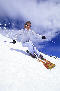 Woman spring skiing in Utah.