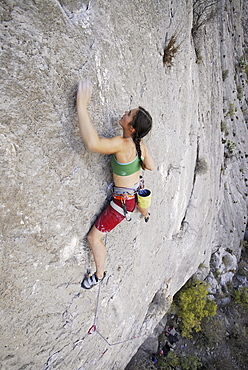 A rock climber ascends a steep rock face in Mexico.