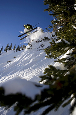 Skier catching some air in the Wasatch Mountains.