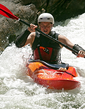 Man kayaks in whitewater rapids on Wilson Creek, NC.