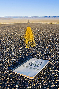 The Official Highway 50 Survival Guide sits on Highway 50, The Loneliest Road in America, in the Nevada desert.