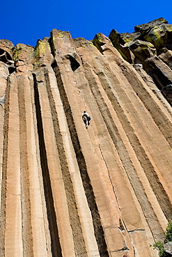 A mid adult man rock climbing at Trout Creek, Oregon.