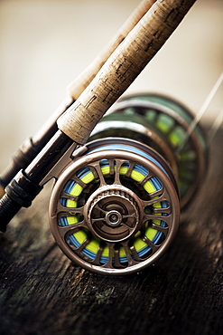 a short focus shot of fly reel resting on wooden plank, San Pedro, Belize