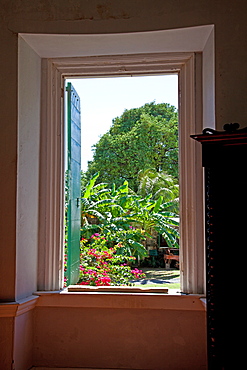 Frederiksted, St. Croix: Bedroom window detail of the main estate house at Estate Whim. Now a museum, this restored sugar and rum estate traces its Danish beginnings to 1733-35. Listed on the National Register of Historic Places, it is furnished to the 1810 era with outbuildings that include a cookhouse, an earlier windmill, and the remains of a sugar factory.