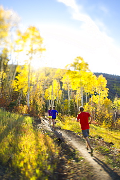 Group of people running on a trail in Park City, Utah