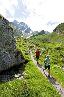 Regina Kinzner and Jochen Reiser hiking in the mountains of Appenzellerland, Switzerland.