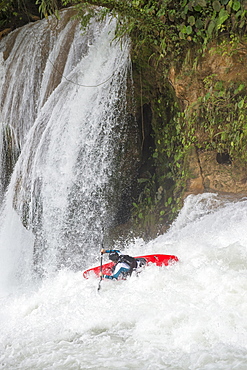 One kayaker descending a white water river at Cascadas de Agua Azul, Chiapas, Mexico.