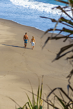 Couple are walking on the beach in Bali. Indonesia