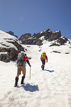 Two climbers approach Trio Peak in British Columbia, Canada.