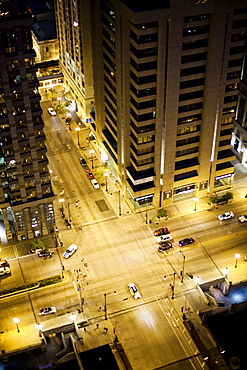 An aerial view of a busy intersection in a large city at dusk, United States of America