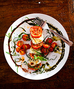 A plate of cheese, tomatoes, and basil at a restaurant in Todos Santos, Baja California Sur, Mexico