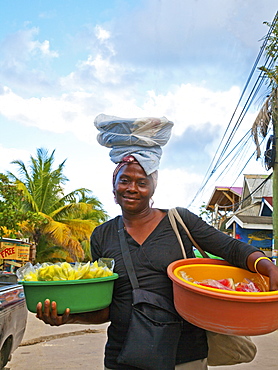 Unidentified food vendor peddles her wares in West End, the largest settlement on Roatan.