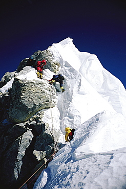 Mountaineers navigating through the Hillary Step on Mount Everest. The Hillary Step is a nearly vertical part (height around 40 ft) of upper Mount Everest. It lies almost at the top of the mountain, halfway from the "south summit" to the summit top, and is the last real challenge before the summit. It is reached by climbing the South East route. It was named after Sir Edmund Hillary, who was the first person, along with Tenzing Norgay, who passed it to reach the summit, Nepal