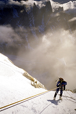 A mountaineer rappels down Cerro Torre's south east ridge in the early morning, after an ascent of the peak in Argentine Patagonia. Cerro Torre is one of the most difficult and iconic peaks in the Southern Andes, and is a highly sought after summit by the worlds top alpinists, Argentina