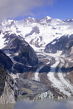 A glacier entering a silty lake, Glacier Bay National Park, Alaska, United States of America