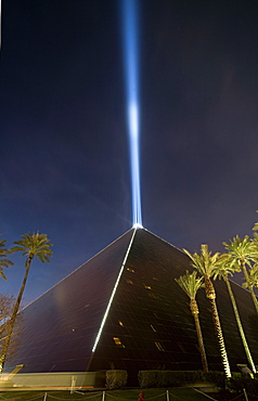 Pyramid with a light beam shooting out of the top.