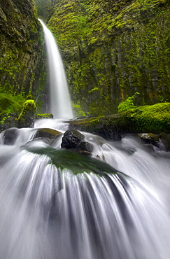 Up-close perspective of cascade and waterfall in Oregon's Columbia Gorge.