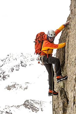 A man climbing Lizard Head Peak, Telluride, Colorado.