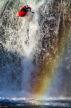 Spanish whitewater kayaker drops down the 40-foot "Tobalina Falls" in Pedrosa de Tobalina, Spain.