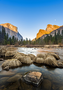 Yosemtie Valley and rising moon at sunset from along the Merced River