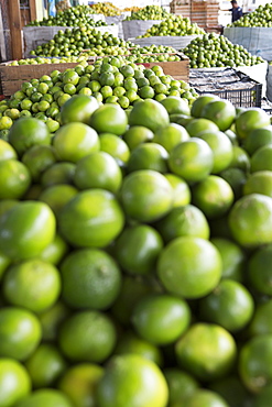 Limes are for sale at an open air market in Guatemala.