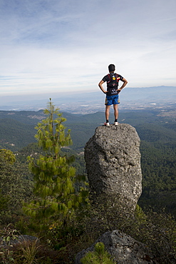 Man Exploring Rancho Santa Elena Standing On Top A Rock In Hidalgo, Mexico