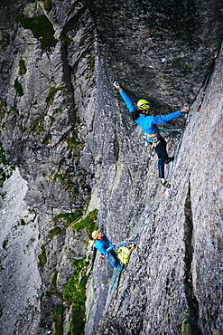 Climbers On Multi Pitch Route In Mountains Of Tatra National Park, Poland