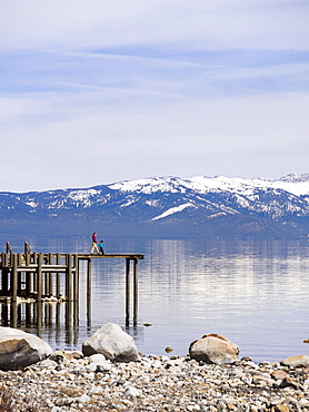 Mother With Her Son Walking On Boardwalk Exploring Lake Tahoe In California, Usa