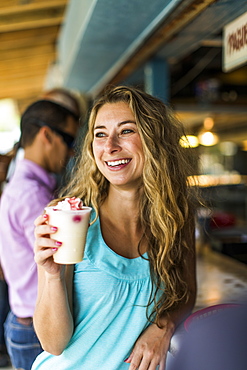 Portrait Of A Woman Enjoying A Pina Colada In Puerto Rico