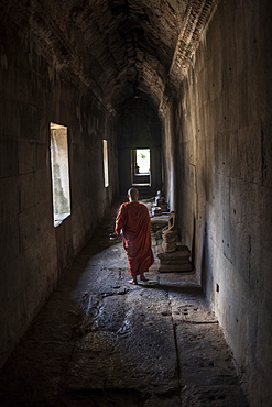 Young Buddhist Monk Walking At The Angkor Wat Temple, Siem Reap, Cambodia