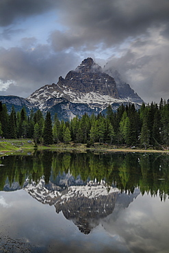 Reflection Of Tre Cime Di Lavaredo Peaks In A Small Pond Near Misurina, Dolomites, Italy