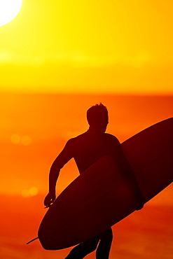 Close-up Of A Male With Surfboard At Sunset