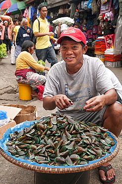 Man Selling Seafood In Street Market At Baguio, Philippines