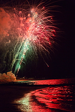 Fireworks explode over the ocean on Cape Cod, MA.