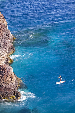 SUP girl enjoying in a beautiful sea