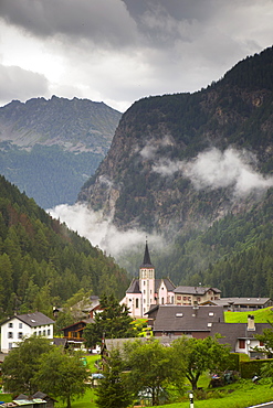 The pink church of mountain village Trient in the Swiss Alps.