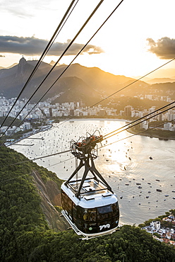 View of Sugar Loaf Mountain cable car with Botafogo Bay during sunset, Rio de Janeiro, Brazil