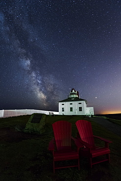 The original lighthouse at Cape Spear in Newfoundland sits dark, with the new lighthouse nearby.  The original lighthouse started operation in 1836, and in 1955 a new concrete light tower was built.  The original lighthouse has been restored to the period of 1839.  This was tricky to shoot because the green light of the active lighthouse would flash every 7 seconds and wash out the scene in intense green.  I didn't like the harsh shadows from the light, myself and my tripod being one of them, so I took a bunch of 6 second exposures and used stacking to get pinpoint stars and low noise in the sky and foreground.  Nikon D5, Nikon 14-24mm f/2.8 lens @ 14mm and f/2.8.  Six shots with the ISO between 12,800 and 25,600, as I was playing around with the camera to get a feel for its performance, stacked in Starry Landscape Stacker for Mac.