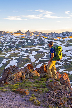 Photograph of single adventurous hiker above Stony Pass near the Grenadiers and the Weminuche Wilderness, Silverton, Colorado, USA