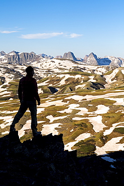 Silhouette of hiker above Stony Pass near the Grenadiers and the Weminuche Wilderness, Silverton, Colorado, USA