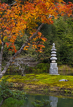 Small pagoda in garden in autumn, Kyoto, Japan