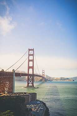 The Golden Gate Bridge is a suspension bridge spanning the Golden Gate, the one-mile-wide (1.6 km) strait connecting San Francisco Bay and the Pacific Ocean. The structure links the American city of San Francisco, California the northern tip of the San Francisco Peninsula to Marin County, carrying both U.S. Route 101 and California State Route 1 across the strait. The bridge is one of the most internationally recognized symbols of San Francisco, California, and the United States. It has been declared one of the Wonders of the Modern World by the American Society of Civil Engineers.