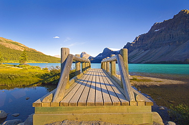 Wooden Foot Bridge And View Of Glacial Lake In Banff National Park; Banff Alberta Canada