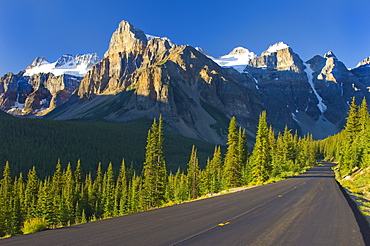 View Of Glacial Mountains And Trees Along The Road To Lake Moraine In Banff National Park; Alberta Canada