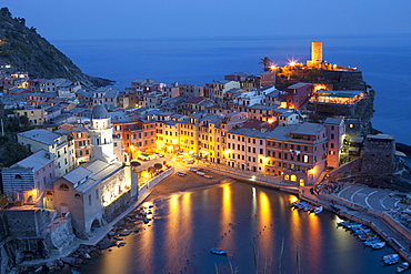 Buildings Along The Waterfront Illuminated At Night; Vernazza Liguria Italy